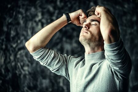 Portrait of a handsome man is thinking hard about something. The power of thought, brainstorming. Business concept.の写真素材