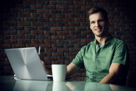 A happy man at office. Work and business. Workplace.