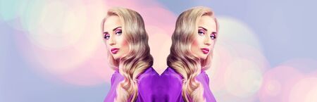 Portrait of a beautiful blonde lady with her reflection in the glow of light. Beauty, fashion.の写真素材