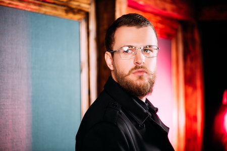 A portrait of a stylish man wearing glasses. Beauty and style for men.