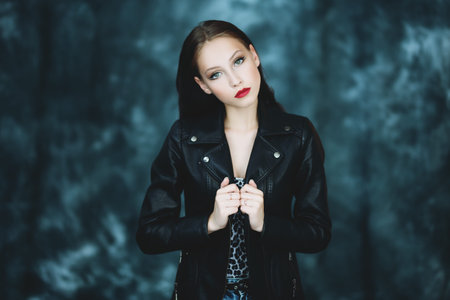 A portrait of a beautiful young woman. Beauty, cosmetics, evening makeup, women fashion.