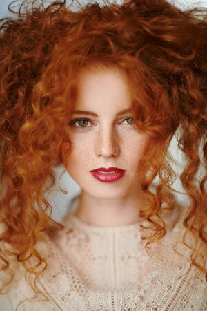 Beautiful young woman with long red hair. Hair care, hair coloring.の写真素材
