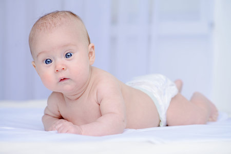 Portrait of a sweet three-month-old baby. Baby care. Healthcare.の写真素材