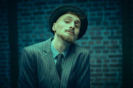 Curious funny detective man looking intently to the camera. Retro style. Occupation, criminal world.の写真素材