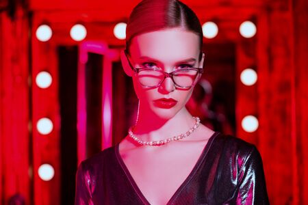 A portrait of a confident lady wearing glasses. Beauty, make-up, style.の写真素材