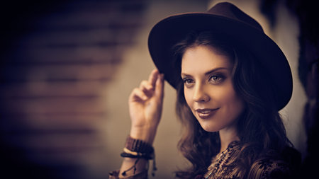 Portrait of a happy young woman smiling at camera. Beauty, fashion. Hippie, boho style.