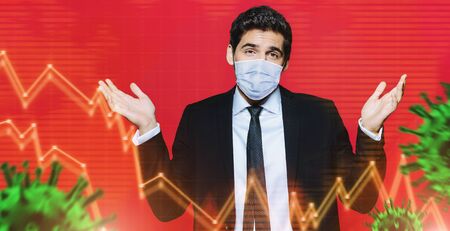 Portrait of a businessman in medical mask behind holographic charts with bacterial molecules. Business concept.  Pandemic.の写真素材