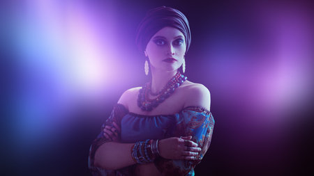 Portrait of a beautiful gypsy woman on a black background. National gypsy costume, ethnic. Make-up...