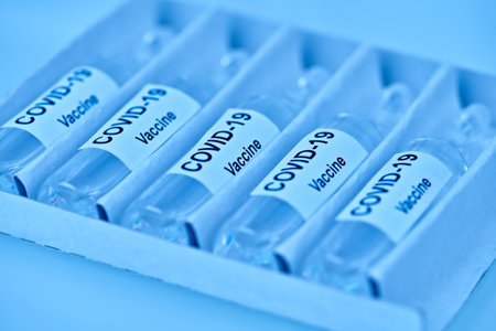 COVID-19 coronavirus vaccine. Victory over coronavirus, photo of ampoules with a vaccine against...