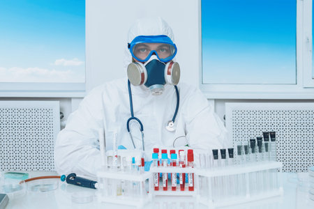 COVID-19. Doctor, microbiologist, scientist in a protective suit, makes a research of coronavirus in...