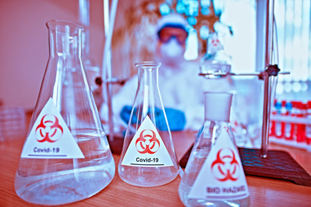 COVID-19 and medicine. Laboratory study of coronavirus, doctor scientist in a protective suit.