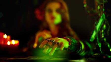 Large photo of a fortune teller's hand with tarot cards.の写真素材