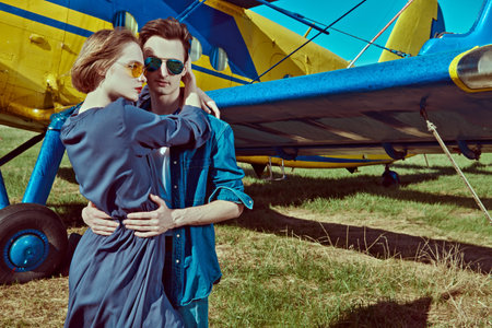 Beautiful couple in love is going to travel by plane. Adventure and travel concept.