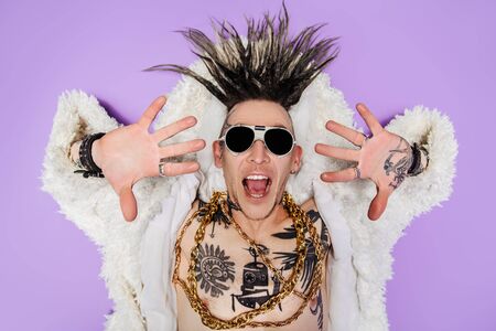 A portrait of a cool young punk man posing in the studio. Casual punk fashion, beauty.の写真素材