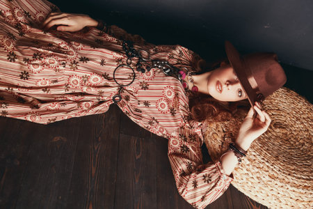 Bohemian, modern hippie style. Fashion shot of a beautiful girl in boho style dress and jewelry...