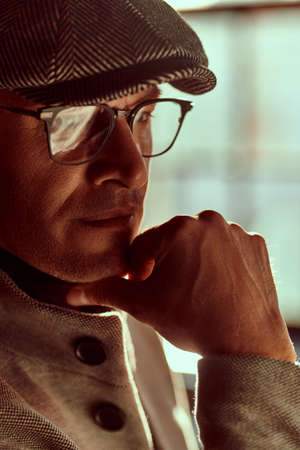 Close-up portrait of a handsome middle aged man in elegant clothes and glasses. Men's beauty, fashion. Optics style.の写真素材