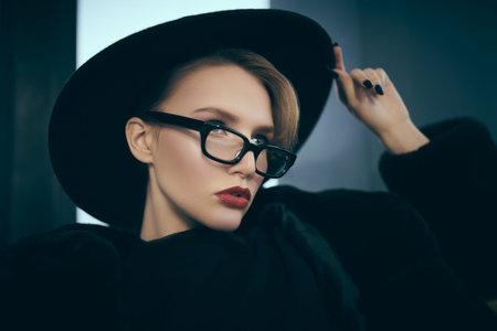 Fashionable young woman in fur coat and elegant glasses. Beauty, fashion. Optics and eyewear.