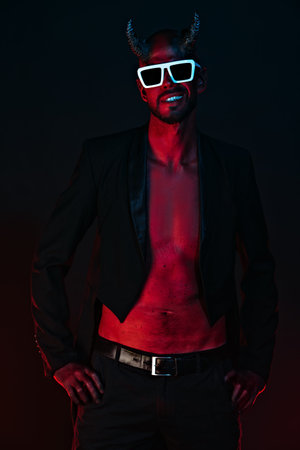A portrait of a bad demon in sunglasses. Horror movie, nightmare. Halloween.