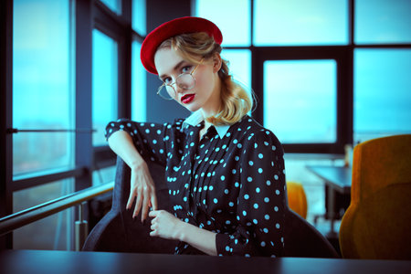 Portrait of an elegant young woman with make-up and clothes in pin-up style. Beauty, fashion. Optics...