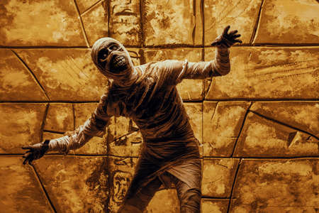 Scary evil mummy climbs out of an ancient Egyptian tomb. Halloween. Ancient Egyptian mythology.の写真素材
