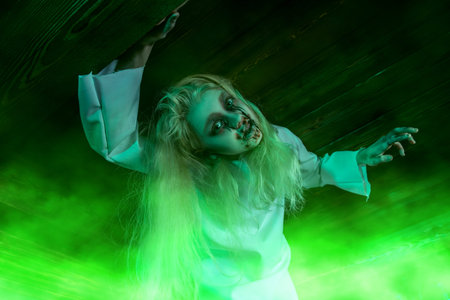 Portrait of a scary pale girl from a horror film in a room. Zombie, halloween.