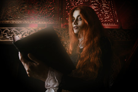 A portrait of a redhead woman with magic book in an old wooden castle. Magic, dark force, spell.