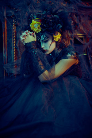 Charming and dangerous Calavera Catrina in an old castle. Sugar skull girl. Day of The Dead. Dia de los muertos. Halloween.の写真素材