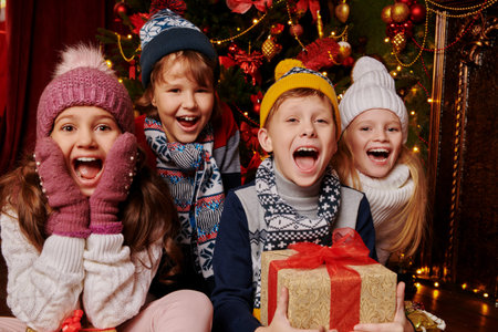 Merry Christmas and Happy New Year! Happy friends celebrate Christmas at home, beautifully decorated...