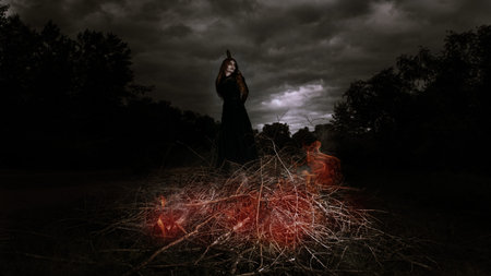 A portrait of an witch tied for incineration. Magic, dark force, spell.