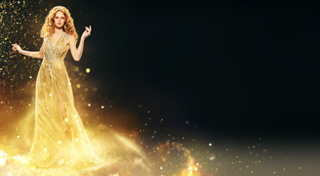 Christmas evening fashion. Full length portrait of a beautiful red-haired woman in a luxury golden...