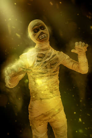Sinister mummy with burning eyes, surrounded by flames. Halloween. Ancient Egyptian mythology.の写真素材