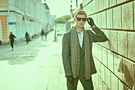 Modern business man in elegant suit on a city street. Men's fashion. Business style.の写真素材