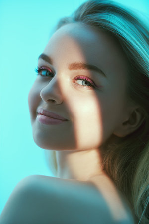 Beauty girl. Body and hair care cosmetics. Portrait of a happy blonde girl with fresh makeup in pink...