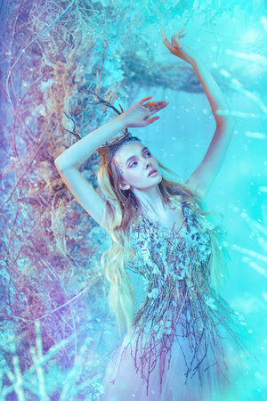 Magical princess in fairy dress in a winter forest. Fairy world.