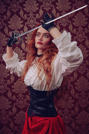 Beautiful red-haired woman with a battle epee (rapier) on a vintage background. The heroine of a...