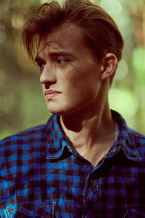 Close up portrait of a handsome young man outdoor. Male beauty.の写真素材