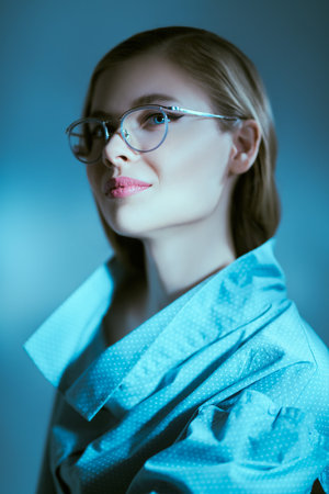 Portrait of a beautiful fashionable young woman in modern glasses. Glasses fashion.
