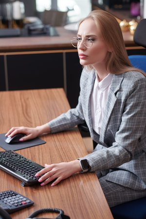 Business concept. Portrait of a beautiful modern business woman working in the office. Successful...