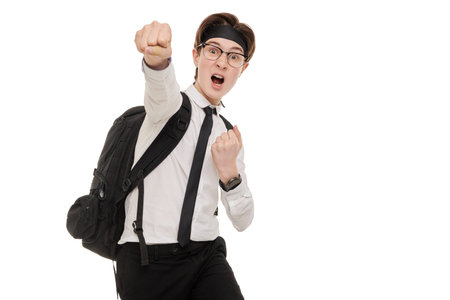 Emotional teenage boy samurai demonstrates successful struggle in studies. Studio portrait on a white background. Educational concept.の写真素材