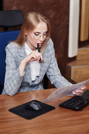 Modern business woman working in her office. Business concept.の写真素材