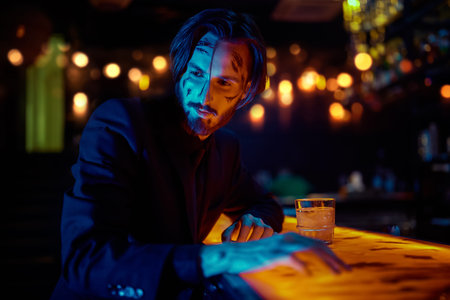 Action movie hero. A wounded special agent drinks whiskey in a bar after completing a dangerous...