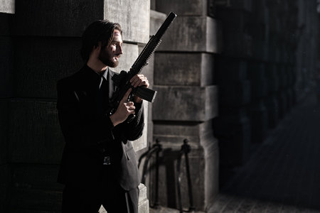 Wounded special agent with an automatic gun on a mission on the street of a night city.