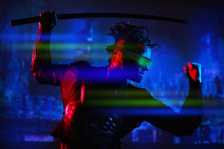 A brave cyberpunk warrior fights with a sword in his hands against the backdrop of the night city of...