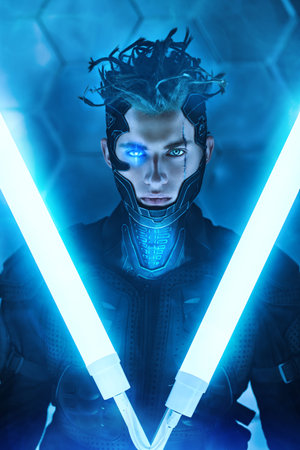 Warrior of the future. A brave cyberpunk warrior in protective uniform stands and looks at camera on...