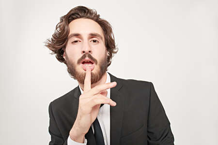 Fashion shot. Portrait of a handsome sensual male model on a white background. People, emotions.の写真素材