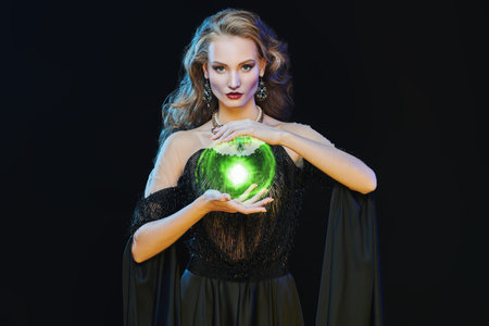 Gorgeous sexy woman lies on expensive silver fox fur coats. Fur coat fashion. Luxurious lifestyle.の写真素材