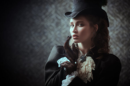 Portrait of an elegant lady in a 19th century suit on a vintage background. Historical hairstyle and...