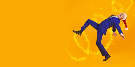 Portrait of a joyful young man in elegant blue suit having crazy fun laughing and running on a...