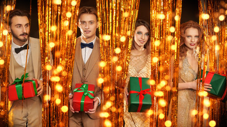 Christmas and New Year celebration. Portrait of beautiful young people in luxury evening clothes...