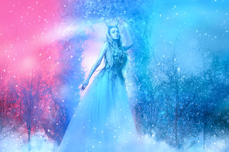 Full length portrait of a graceful forest nymph in a magical winter forest. Christmas winter's tale.